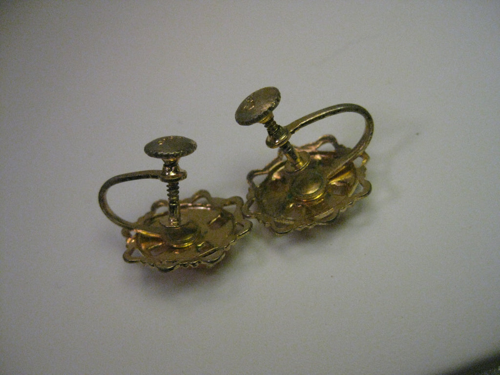 Help! I decided to wear these vintage screw back earrings I
