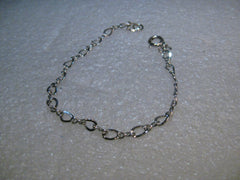 Sterling Silver 7" Charm Bracelet, 2.65 grams, 4mm wide.