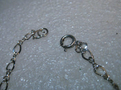 Sterling Silver 7" Charm Bracelet, 2.65 grams, 4mm wide.